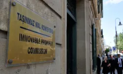 Rum Meclisi, "Göçmenlerin" TMK’ya başvurmaması için kurmayı hedeflediği fonu Bakan ile ele aldı